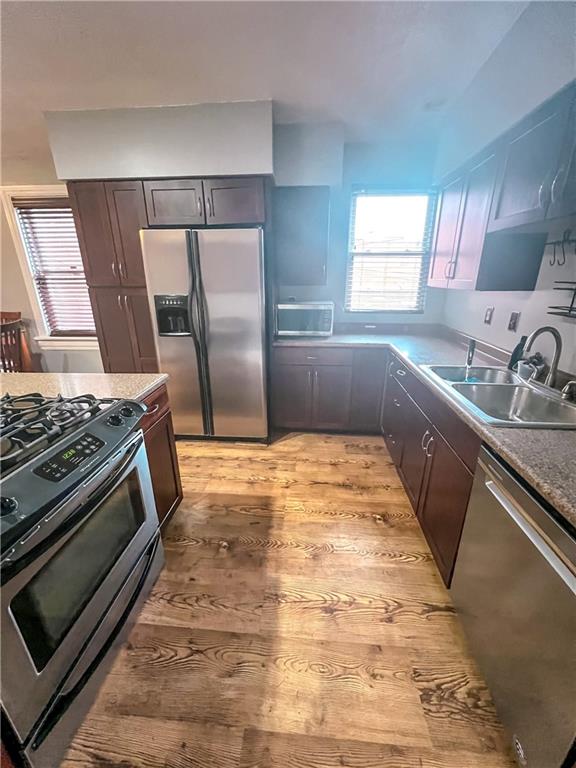 2414 East Carson Street, Unit 2 Pittsburgh, PA 15203 - Photo 7 of 15 a kitchen with a stove and a sink