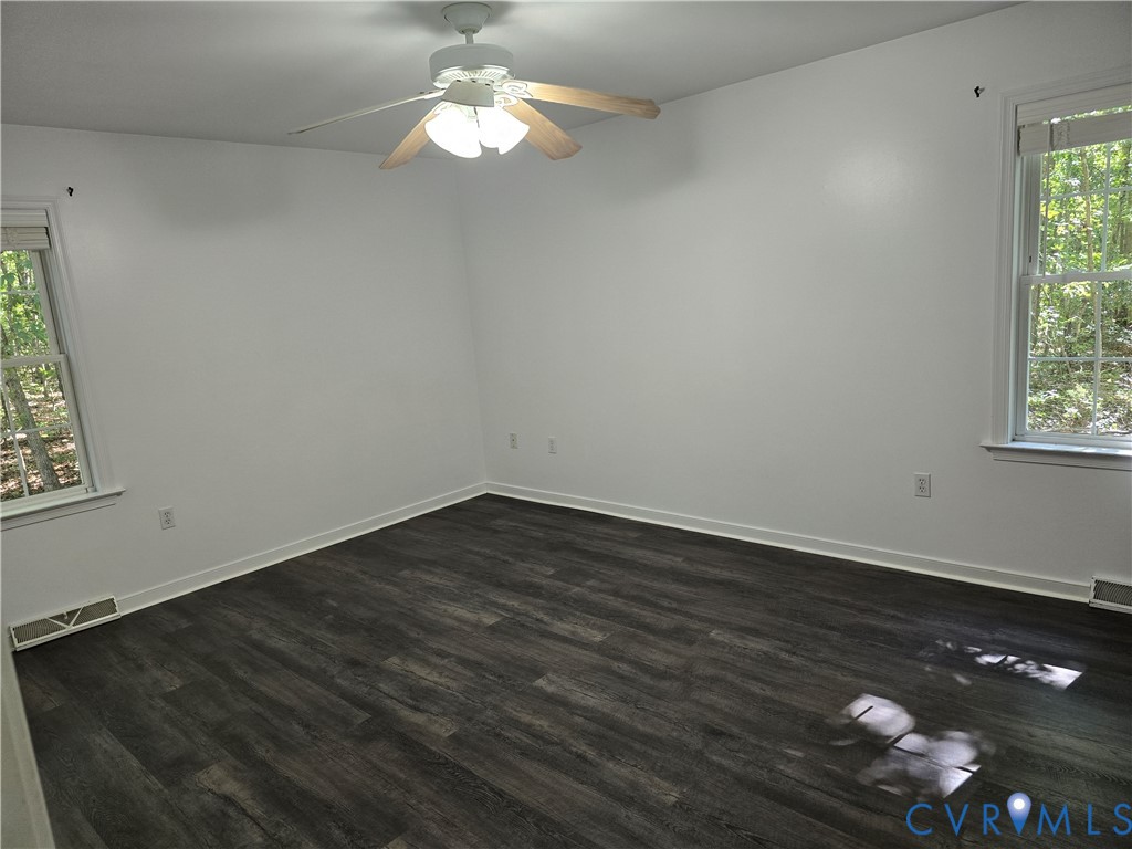 2578 Bagby Road Bumpass, VA 23024 - Photo 14 of 26 Wood-finish flooring, white walls, two windows wit