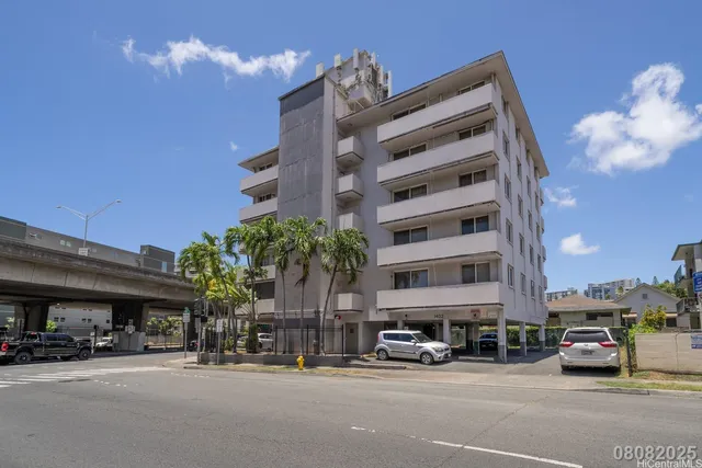 a view of cars parked in front of a building