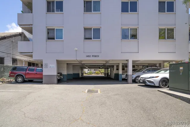 an empty room with wooden floor and chair
