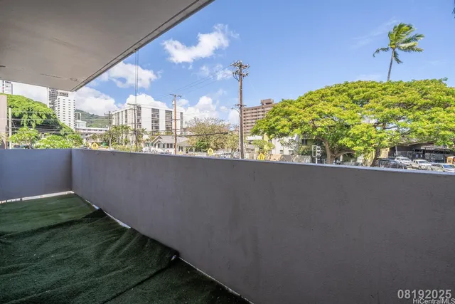 a kitchen with granite countertop white cabinets stainless steel appliances and a sink