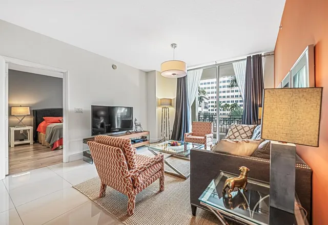 a large kitchen with stainless steel appliances granite countertop a stove and a sink