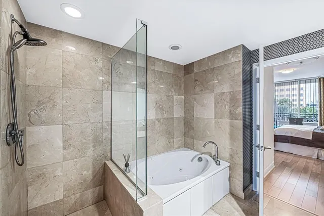 a bedroom with a bed and a chair