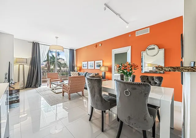 a dining room filled with furniture and window