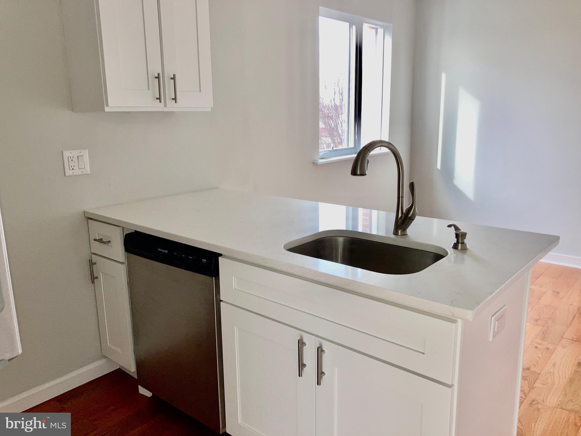 5358 Addison Street, Unit 2 Philadelphia, PA 19143 - Photo 12 of 13 a close view of sink and tap