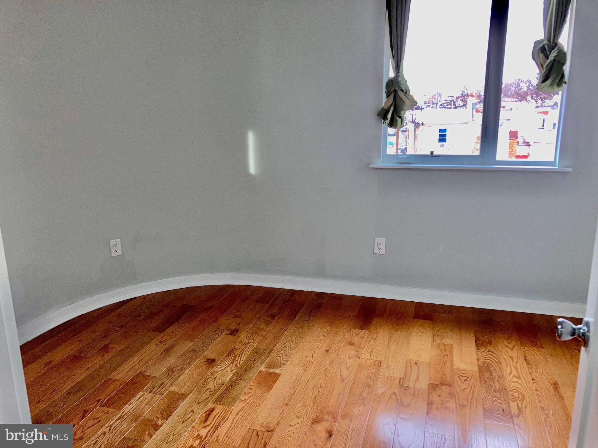 5358 Addison Street, Unit 2 Philadelphia, PA 19143 - Photo 4 of 13 a view of a room with wooden floor and small space