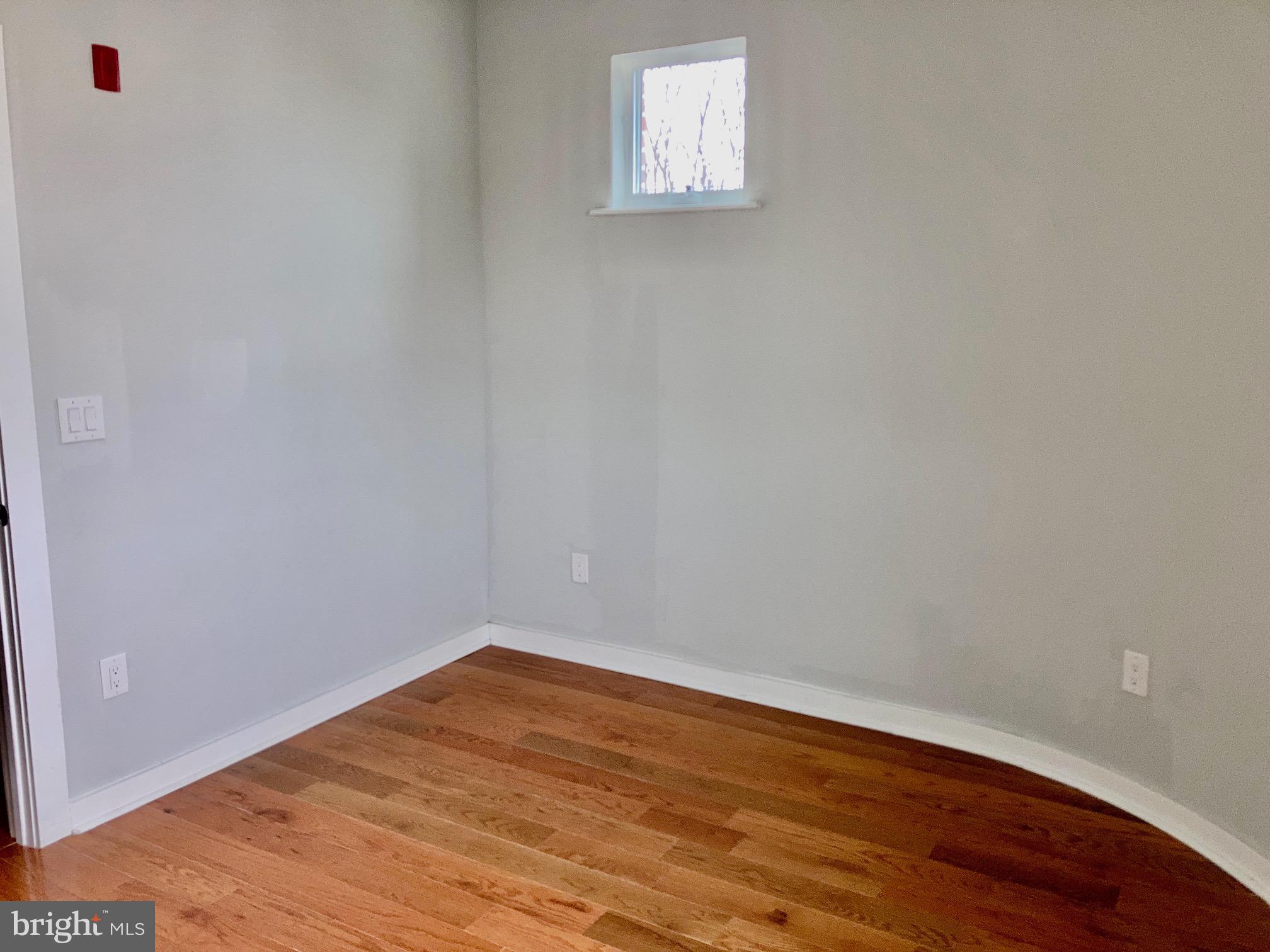 5358 Addison Street, Unit 2 Philadelphia, PA 19143 - Photo 5 of 13 a view of empty room with wooden floor