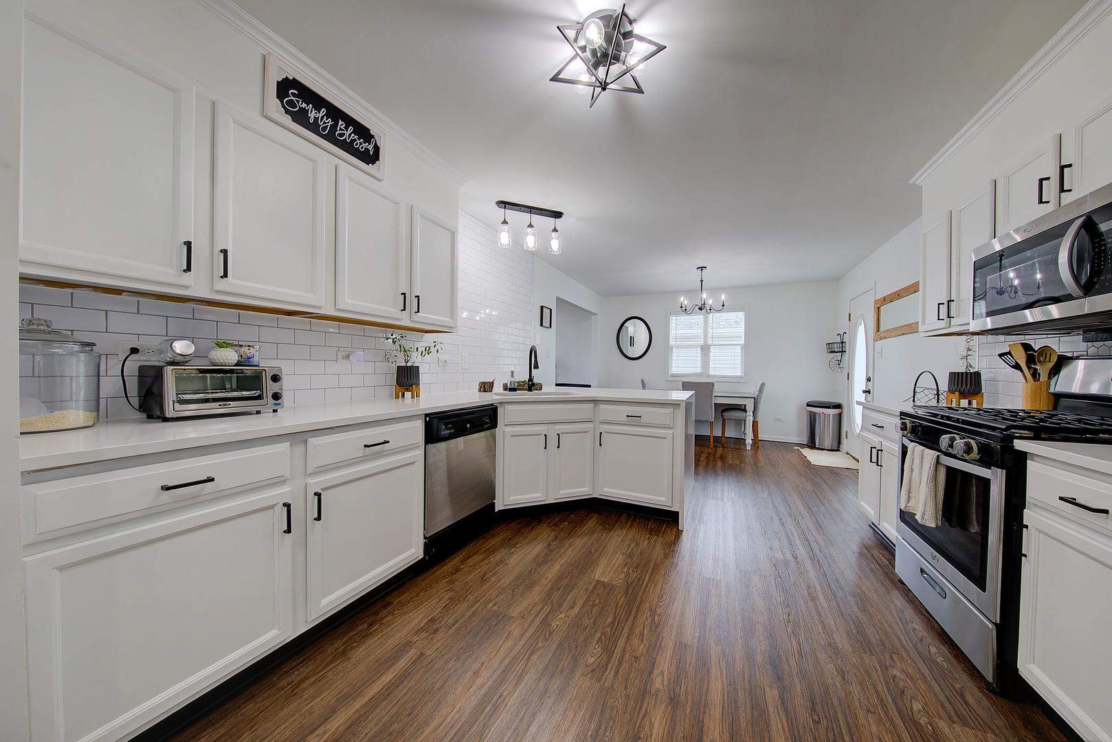 1419 Trailside Drive Beecher, IL 60401 - Photo 12 of 28 a kitchen with stainless steel appliances a white cabinets and wooden floor