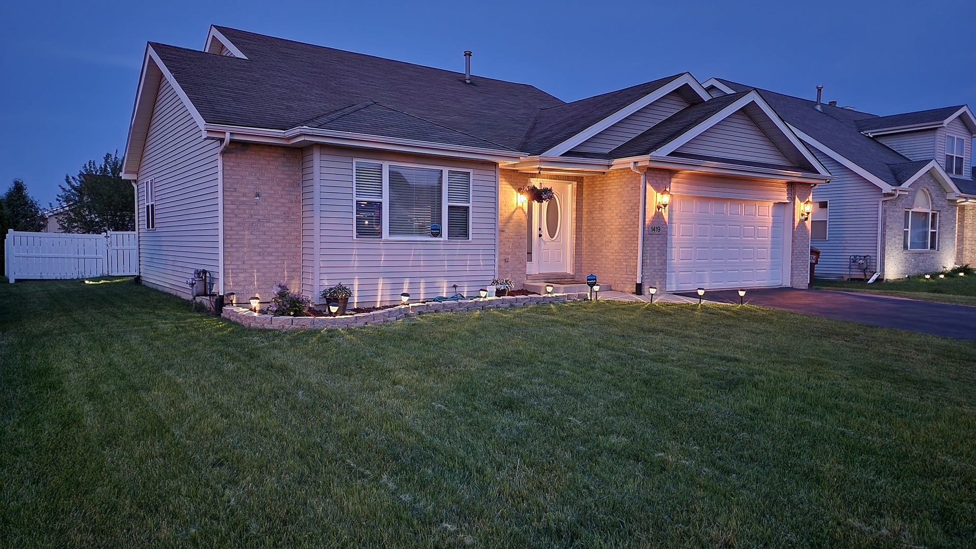 1419 Trailside Drive Beecher, IL 60401 - Photo 4 of 28 a front view of a house with a yard