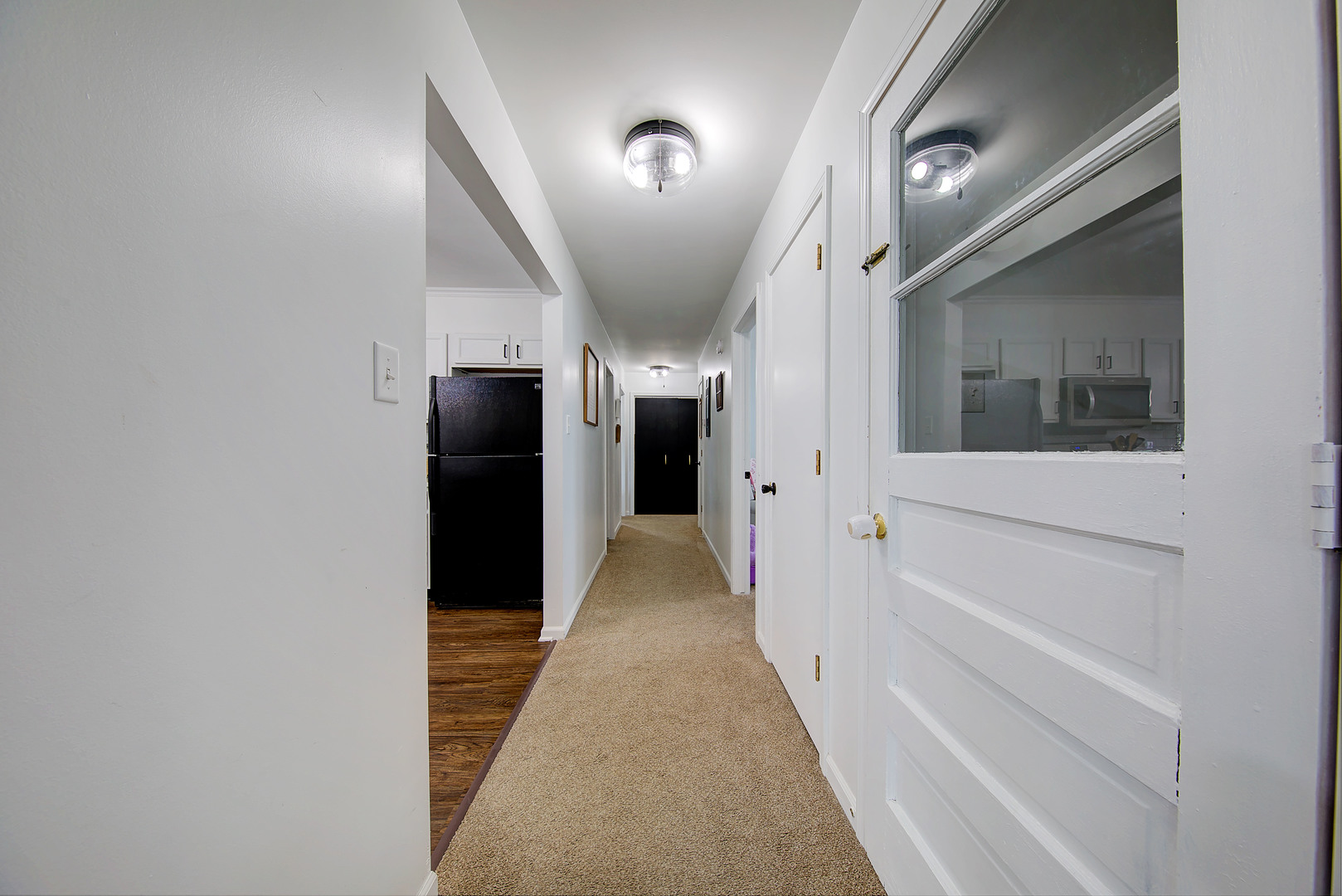 1419 Trailside Drive Beecher, IL 60401 - Photo 10 of 28 a view of a hallway with wooden floor and staircase