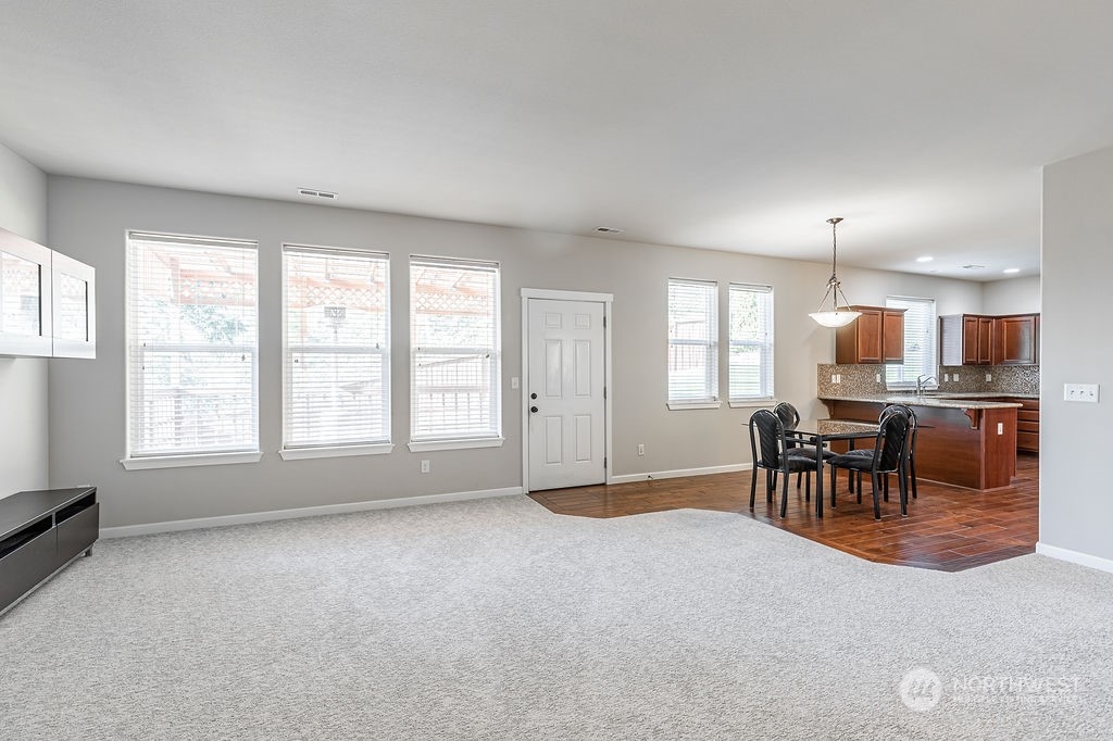 1014 South 32nd Place Renton, WA 98055 - Photo 8 of 37 an empty room with windows and chairs