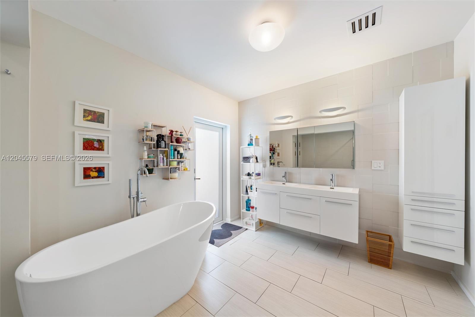 12944 Banyan Road North Miami, FL 33181 - Photo 15 of 26 a bathroom with a bathtub and sink