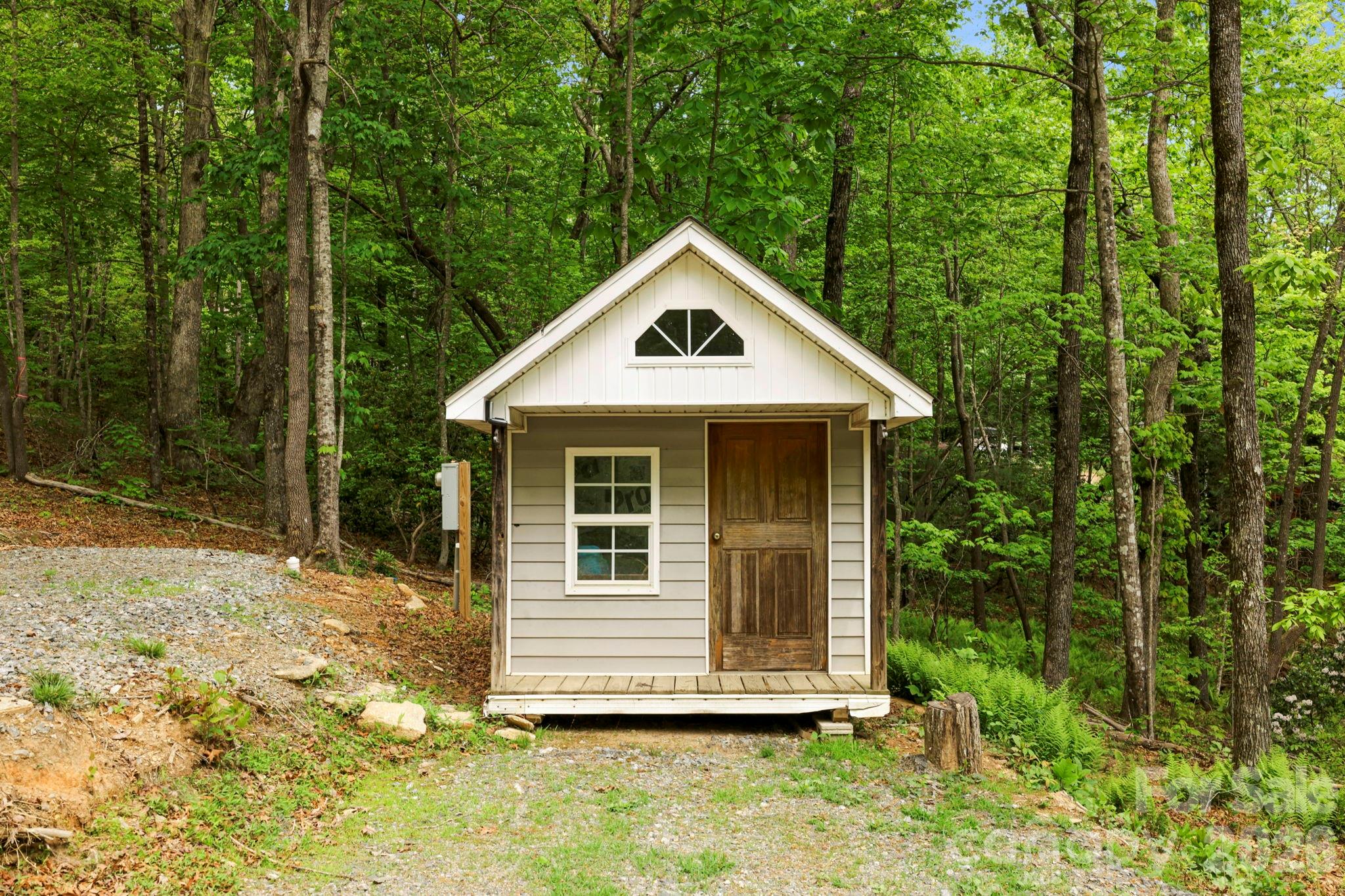 137 Bird Song Road, Unit 3 Penrose, NC 28766 - Photo 6 of 23 a front view of a house with a yard