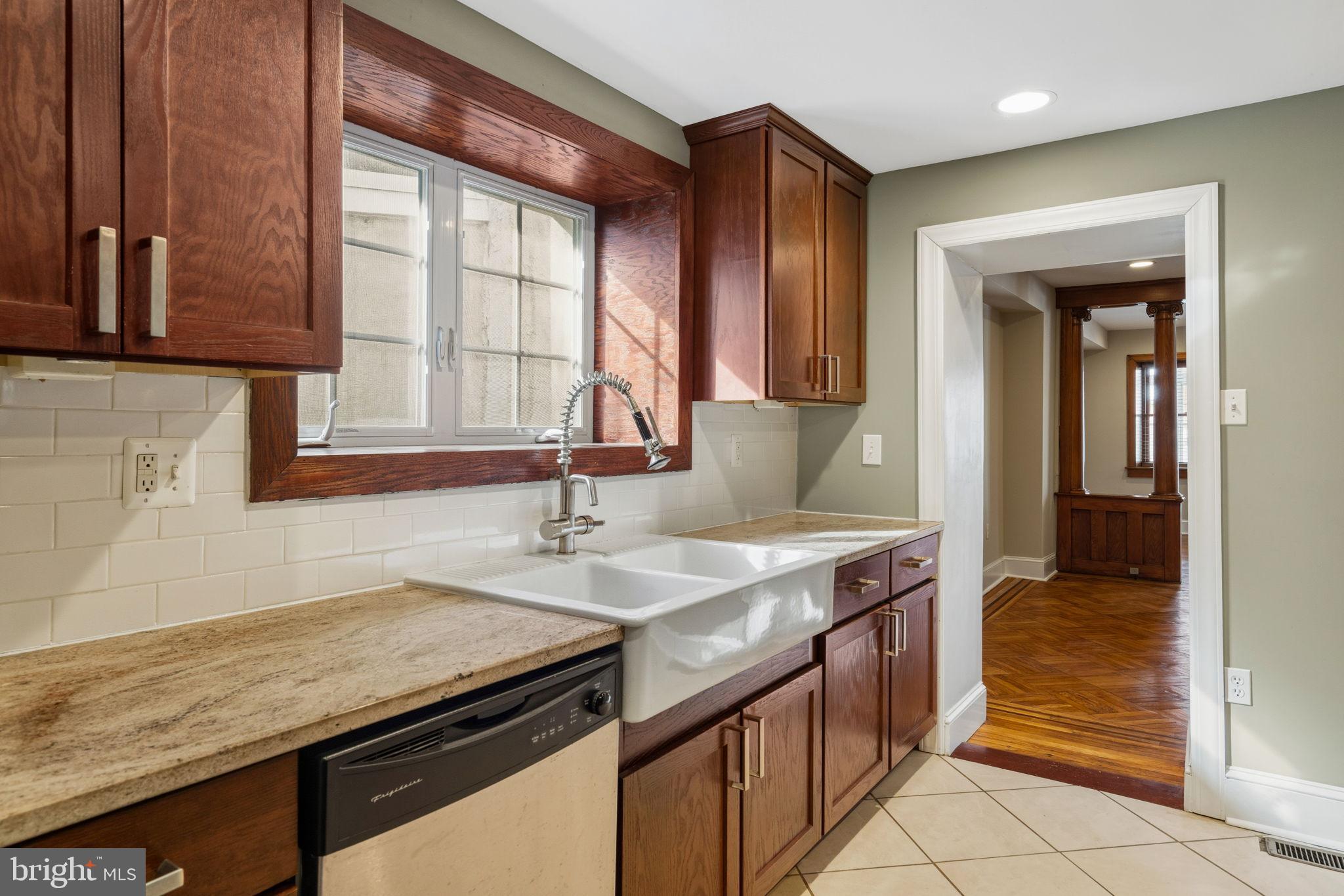 337 Carson Street Philadelphia, PA 19128 - Photo 17 of 36 a kitchen with a sink and a window