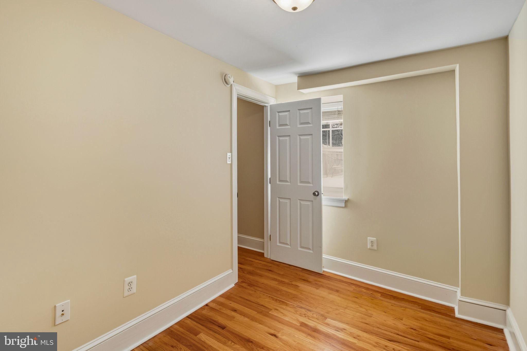 337 Carson Street Philadelphia, PA 19128 - Photo 26 of 36 a view of an empty room with wooden floor and a window
