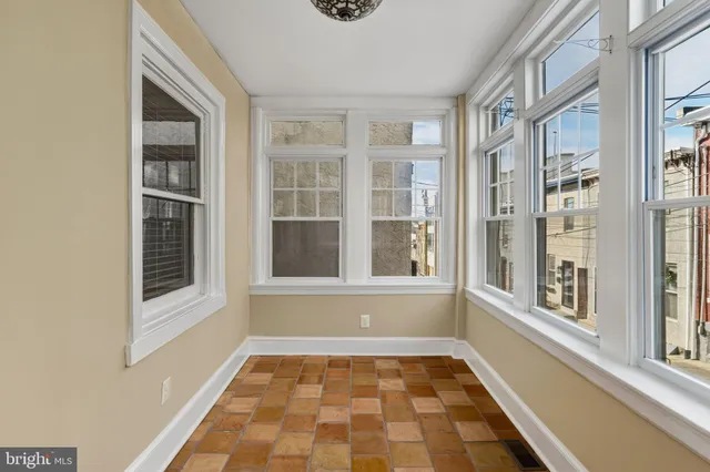a view of empty room with windows