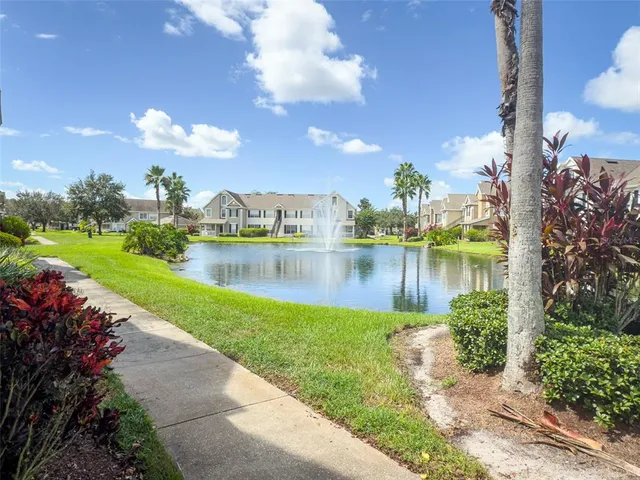 a view of a lake with a house in the background
