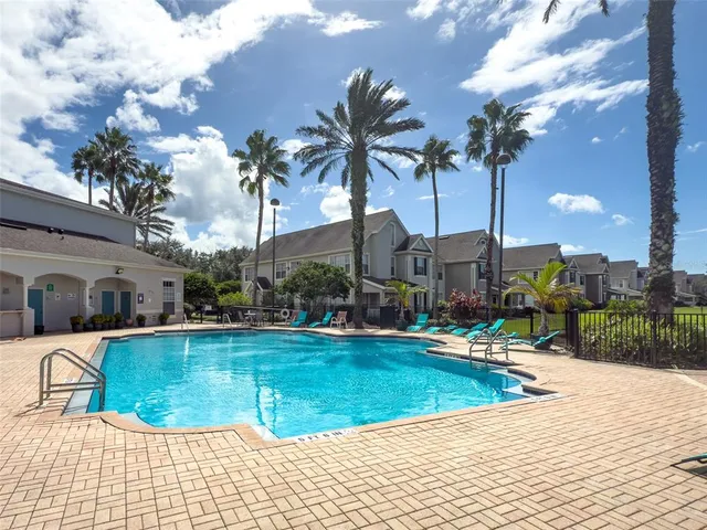 a view of a swimming pool with a lounge chairs