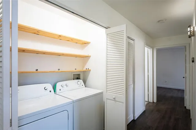 a view of storage and utility room with washer and dryer