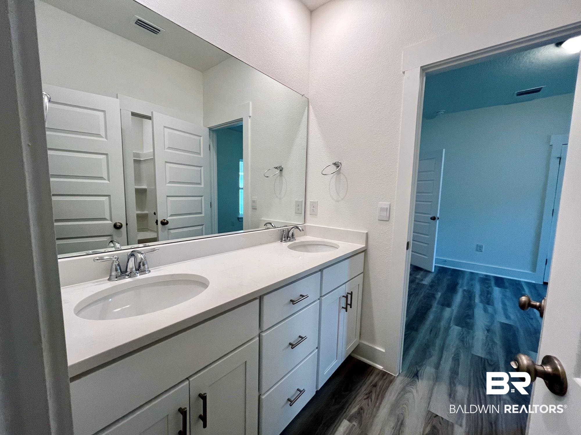 334 Barndling Street Fairhope, AL 36532 - Photo 19 of 34 Bathroom with vanity and wood-type flooring