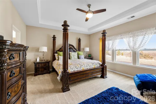 a bedroom with furniture and a window