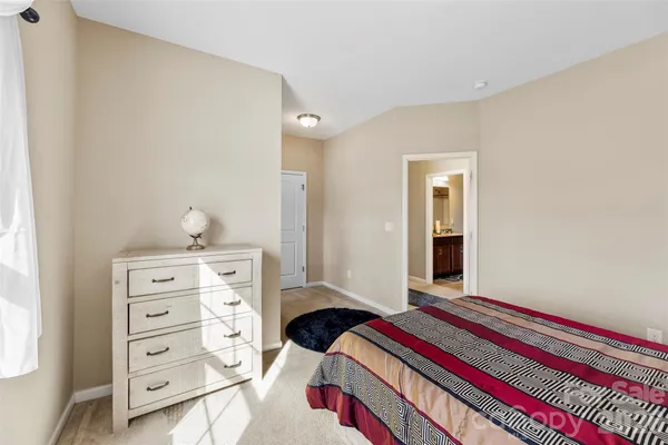 a bedroom with a bed and a cabinets