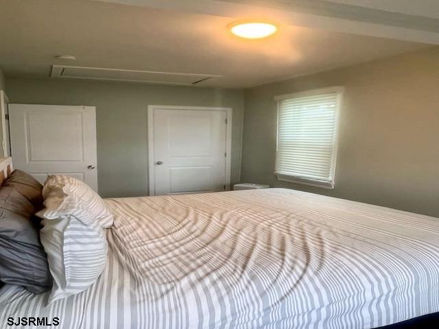 137 Gibbs Avenue Somers Point, NJ 08244 - Photo 14 of 28 a bedroom with a bed and a window