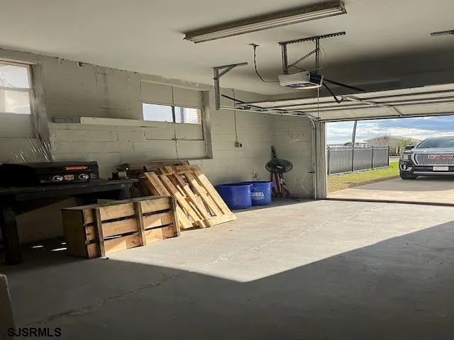 a view of a livingroom with furniture and staircase