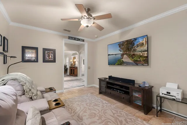 a living room with furniture and a flat screen tv