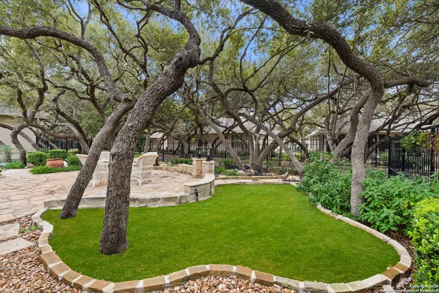 a view of a wooden deck with a backyard
