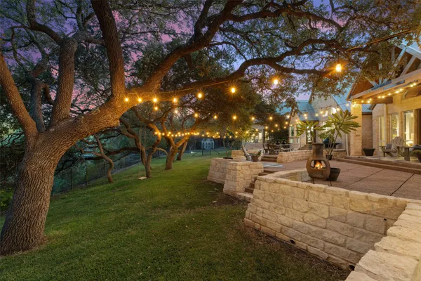 a view of a yard with tree s
