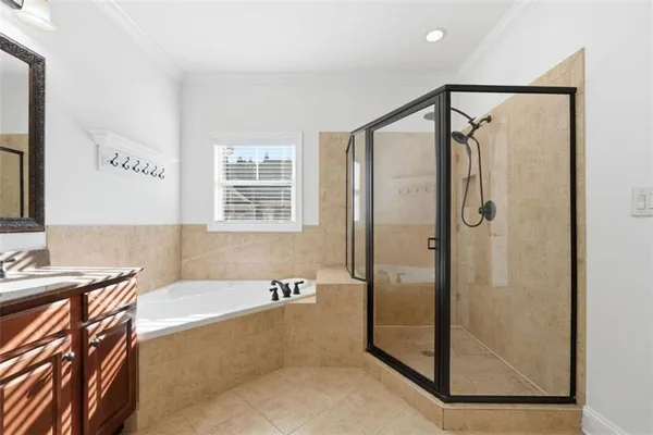 a bathroom with a bathtub and a shower