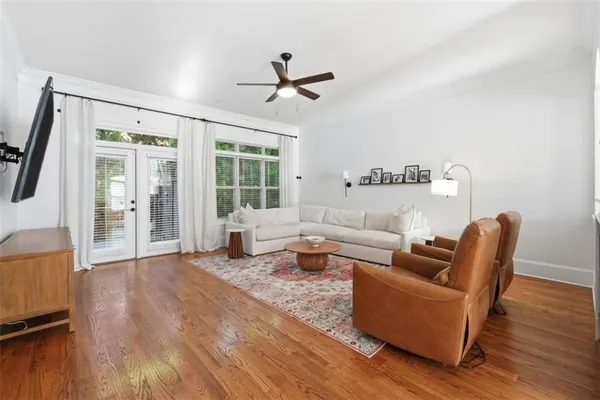 a living room with furniture and a large window