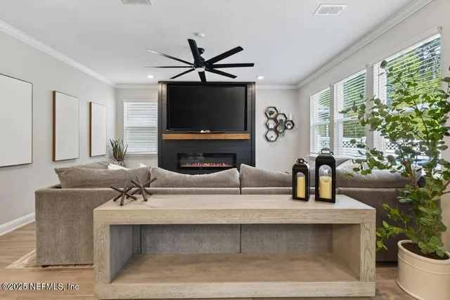 a kitchen with stainless steel appliances a stove a microwave a sink and cabinets