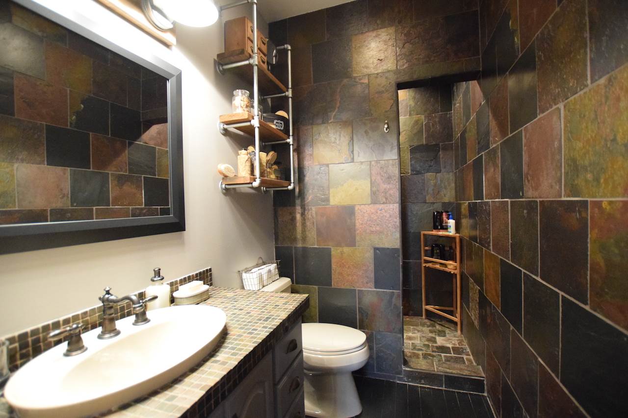 929 East State Line Road Orangeville, IL 61060 - Photo 14 of 25 a bathroom with a sink toilet and shower
