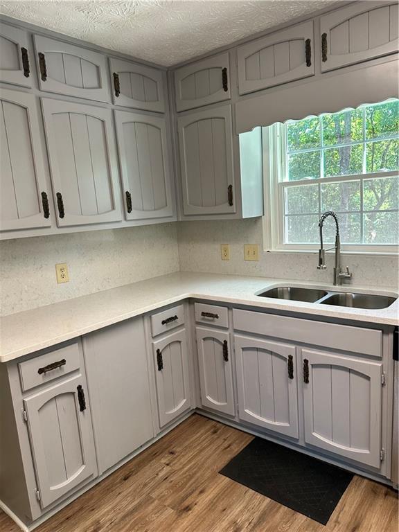 3305 Maple Ridge Court Suwanee, GA 30024 - Photo 15 of 33 a kitchen with white cabinets and sink