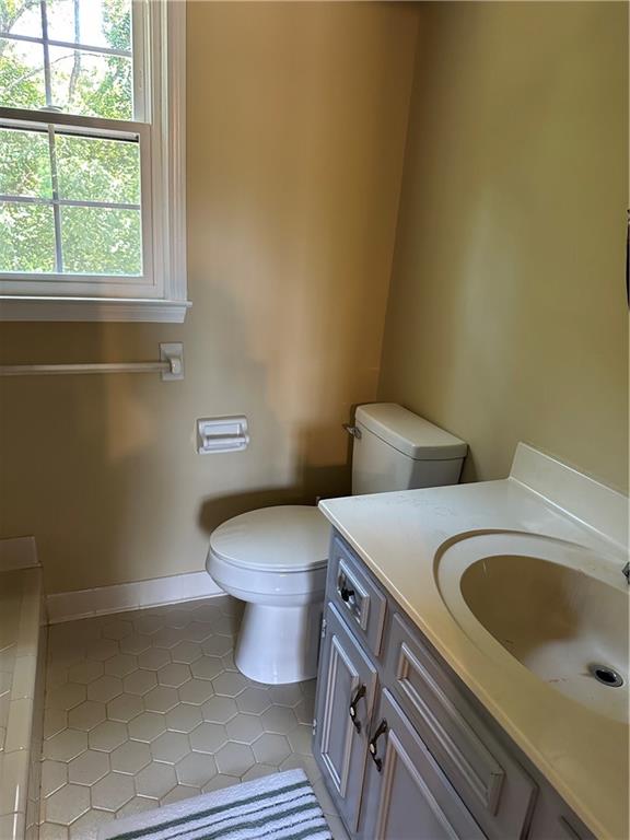 3305 Maple Ridge Court Suwanee, GA 30024 - Photo 26 of 33 a bathroom with a sink and a toilet