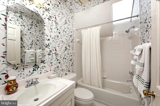 a spacious bedroom with a bed and a couch