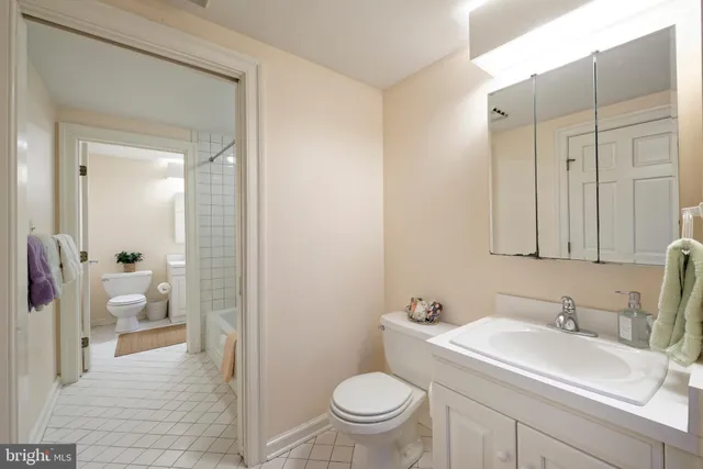 an aerial view of residential houses with outdoor space and trees all around