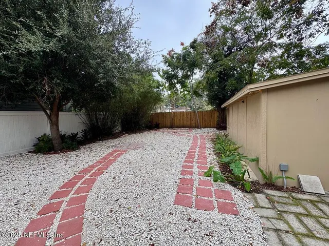 a backyard of a house with lots of green space