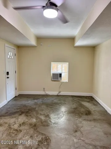 a view of an empty room and window