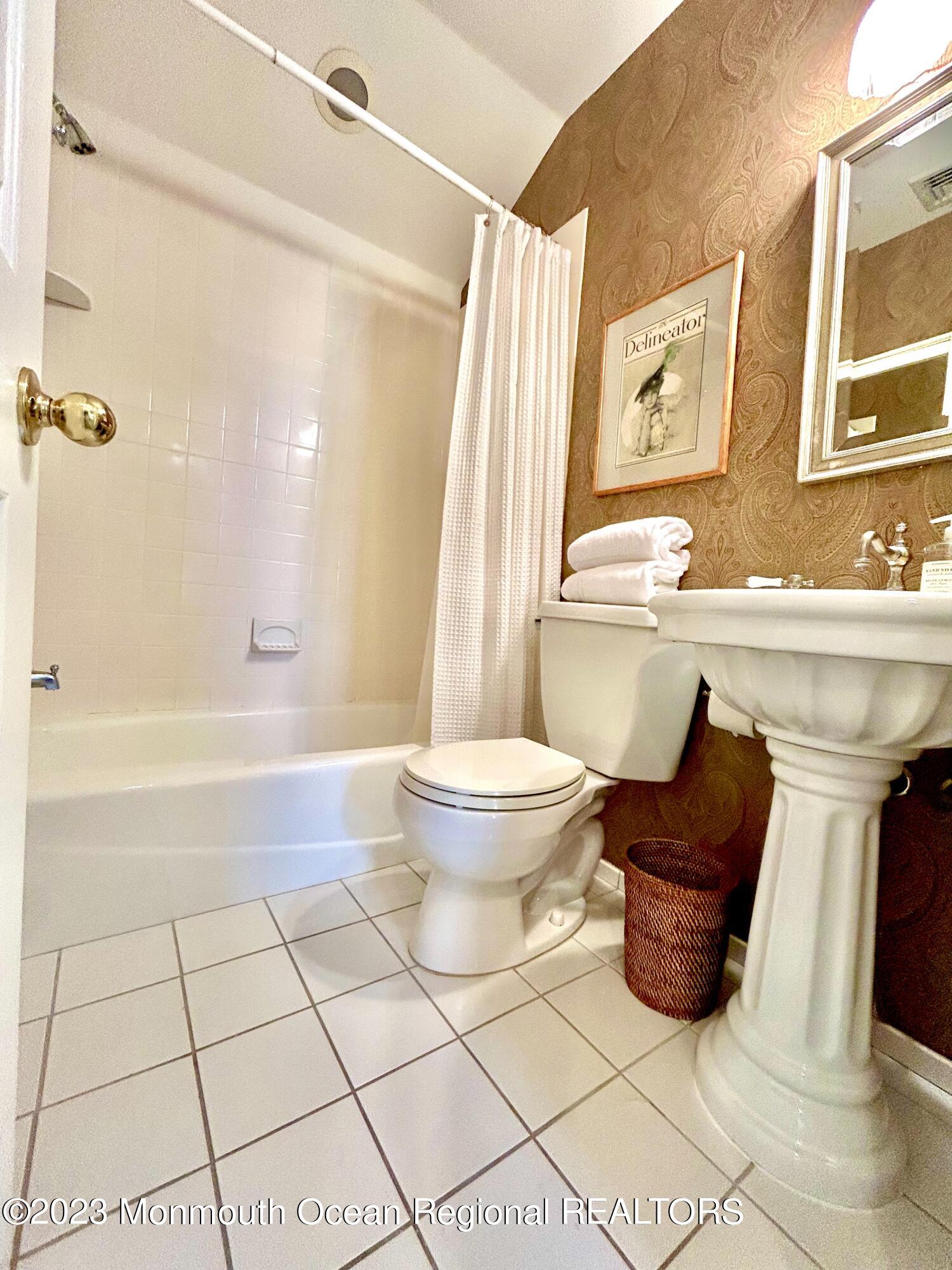 208 Passaic Avenue Spring Lake, NJ 07762 - Photo 11 of 19 a bathroom with a sink toilet and shower