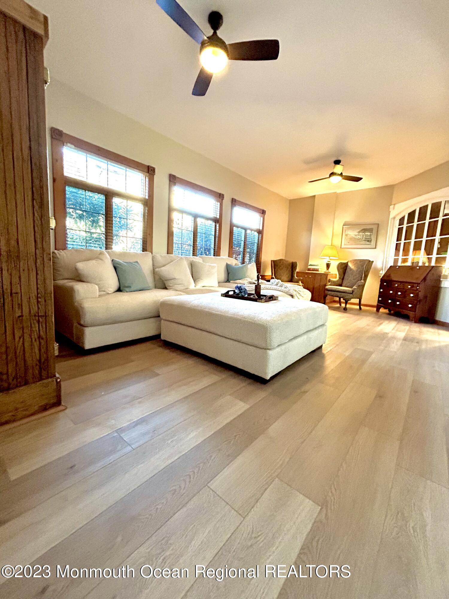 208 Passaic Avenue Spring Lake, NJ 07762 - Photo 3 of 19 a living room with furniture and a large window