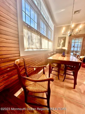 a view of a dining room with furniture and window