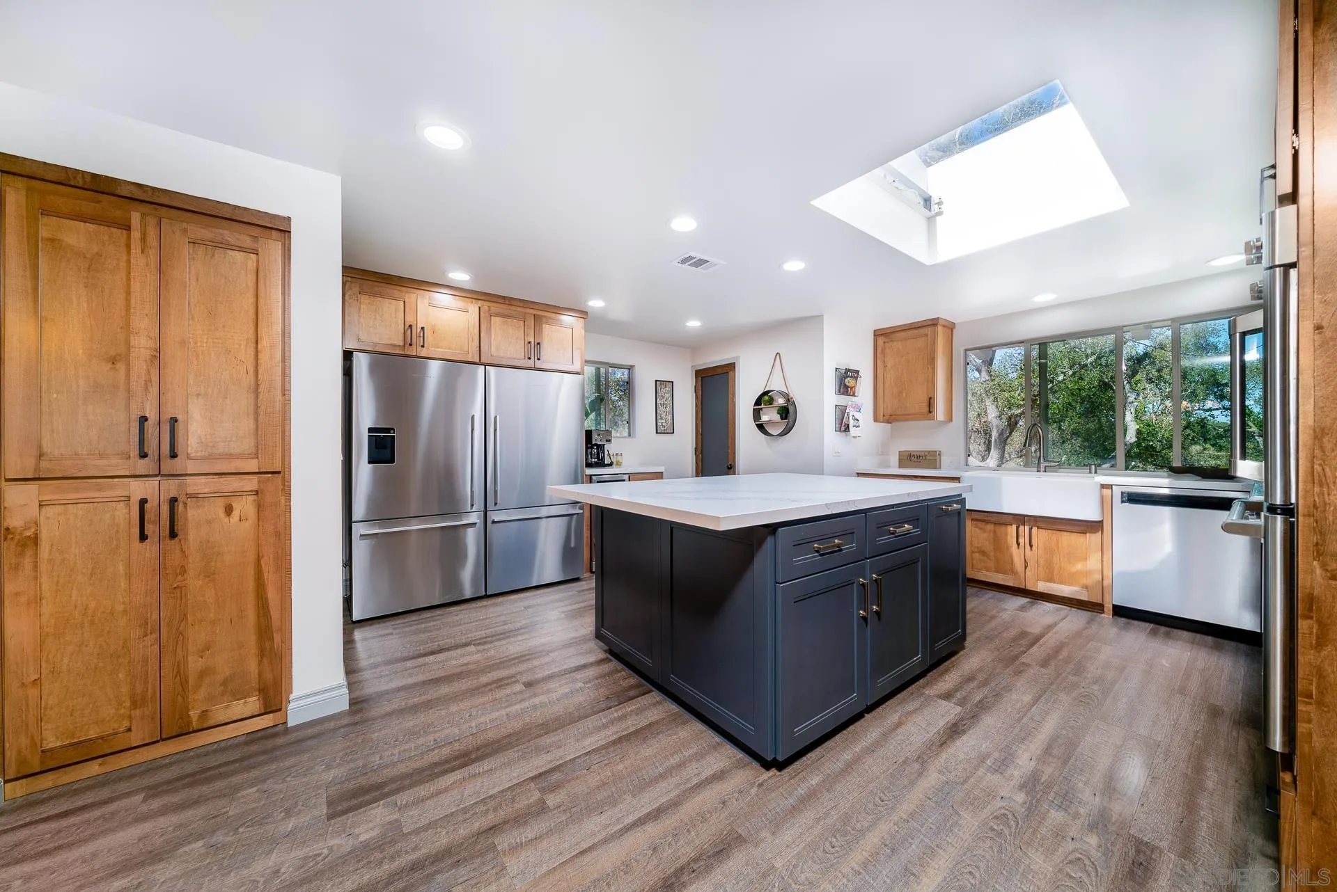 3978 Ladera Vista Road Fallbrook, CA 92028 - Photo 3 of 48 a large kitchen with stainless steel appliances granite countertop a large counter top a sink a refrigerator and a stove
