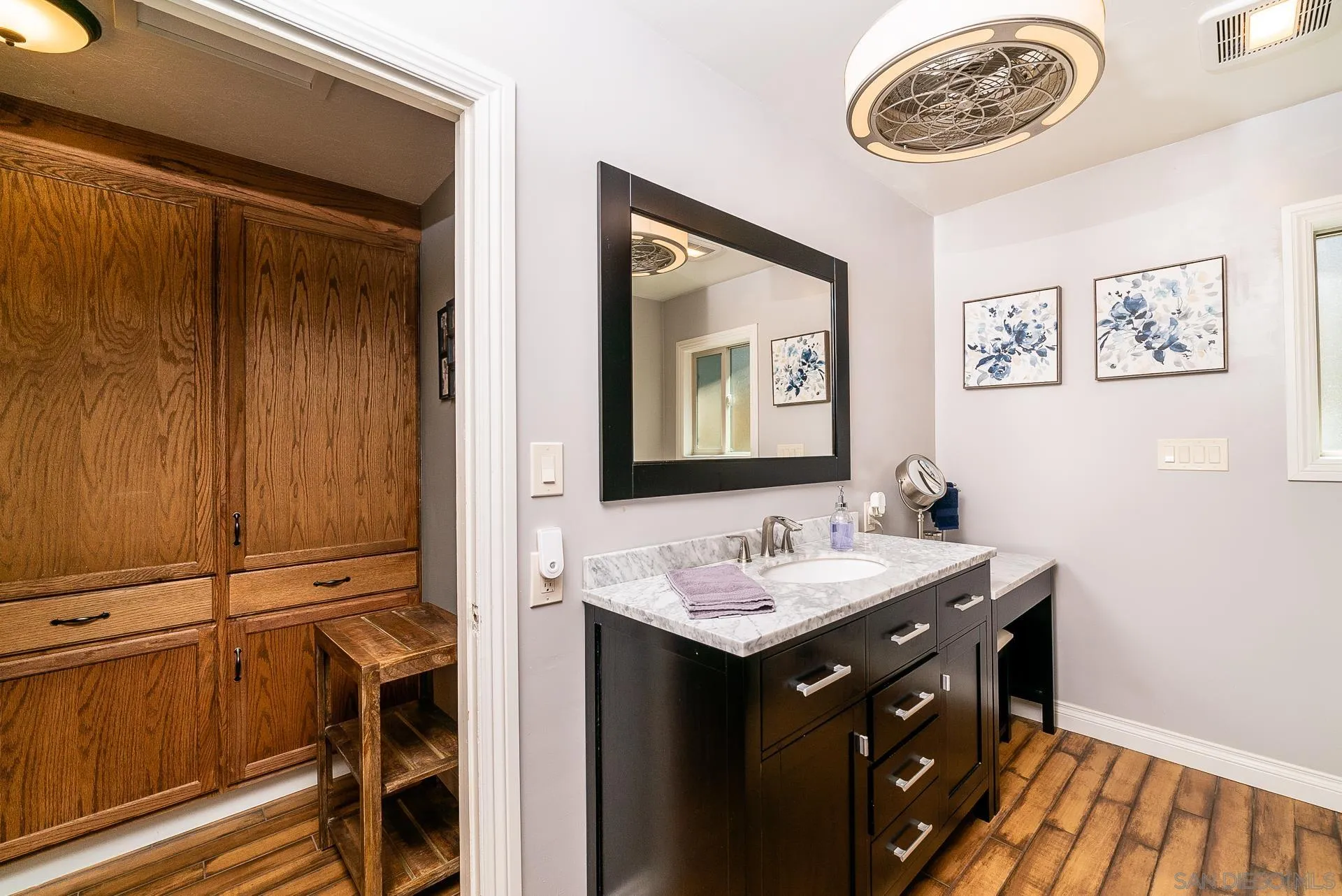 3978 Ladera Vista Road Fallbrook, CA 92028 - Photo 35 of 48 a bathroom with a sink and a mirror