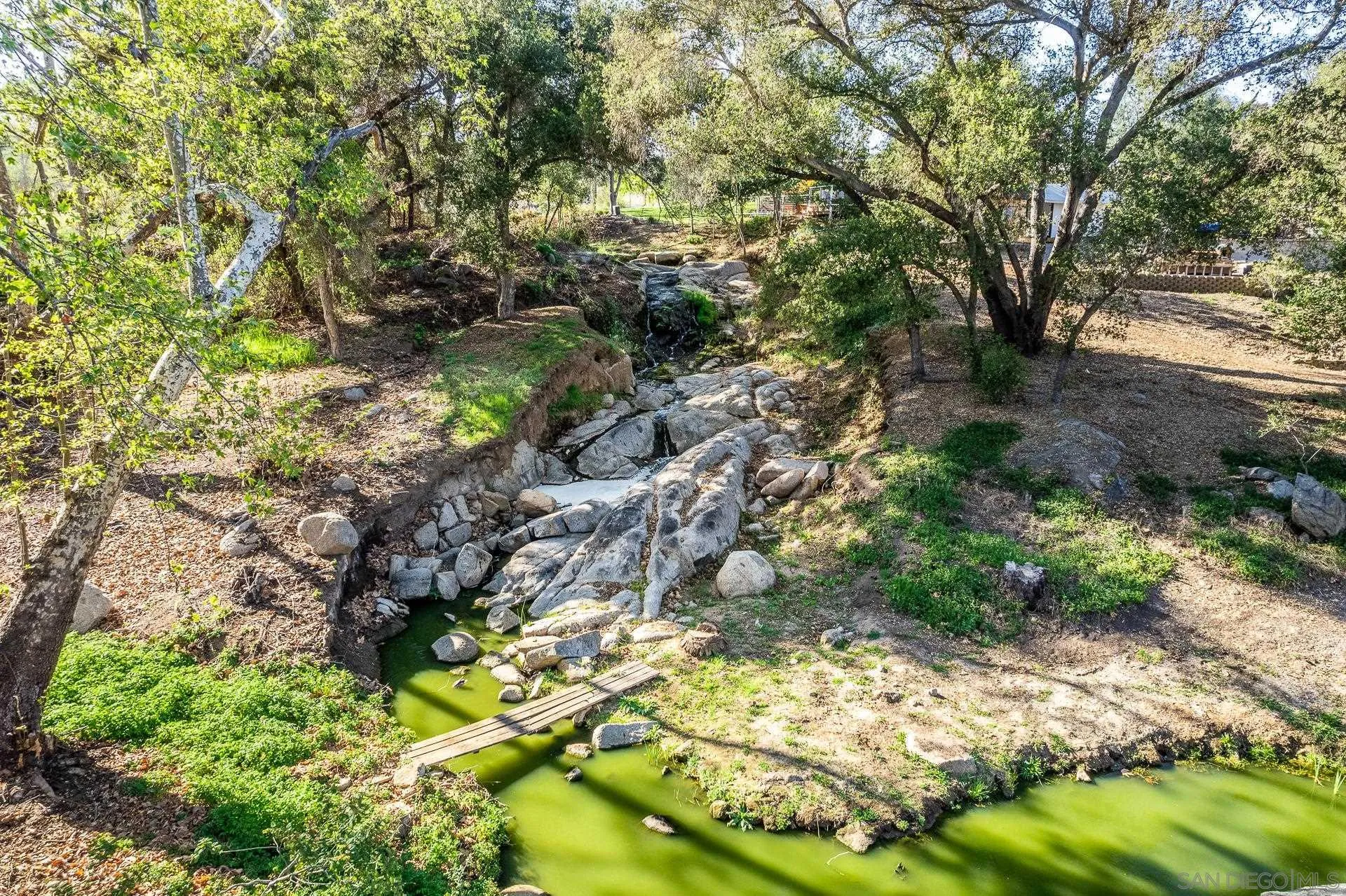 3978 Ladera Vista Road Fallbrook, CA 92028 - Photo 46 of 48 a backyard of a house with lots of green space