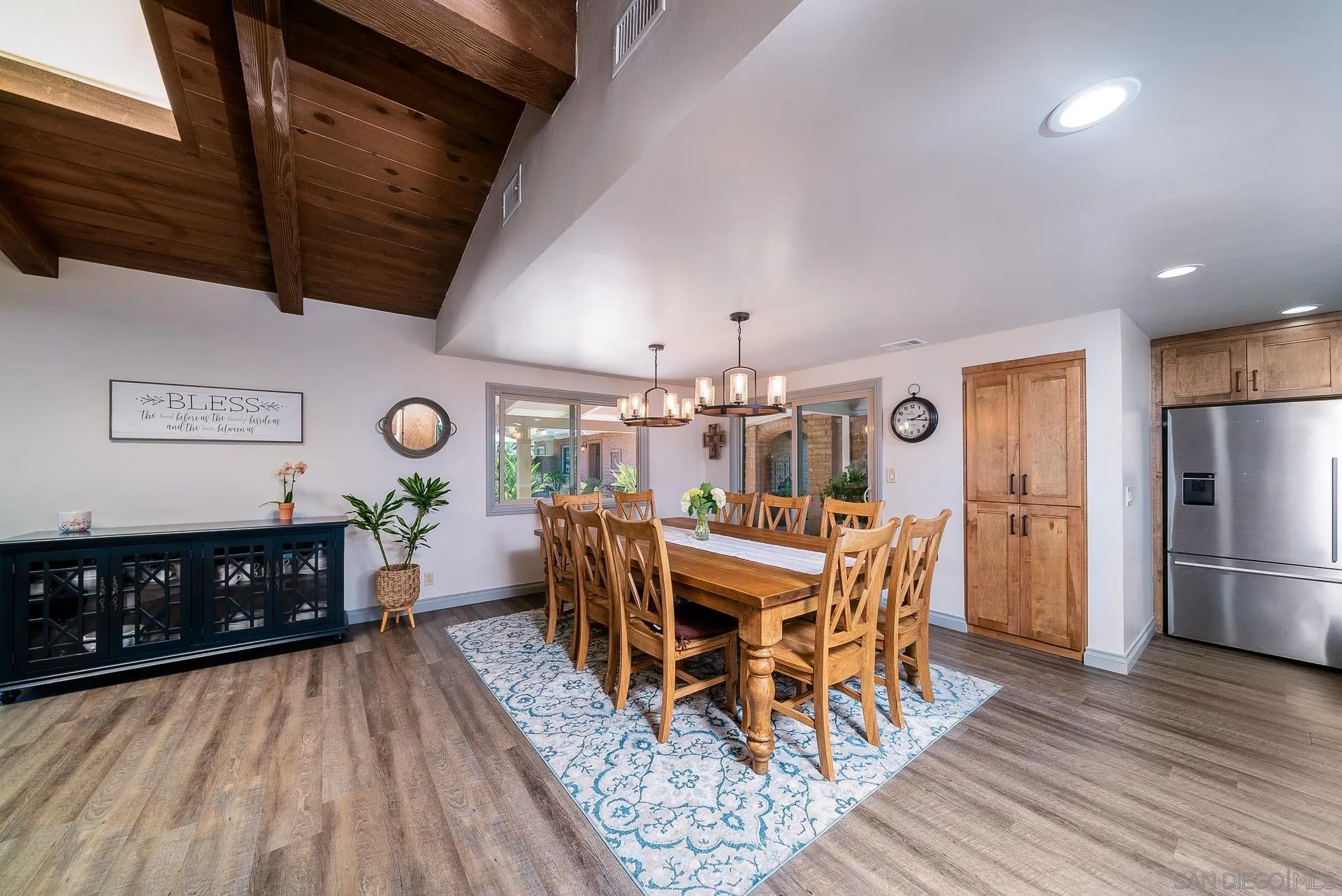 3978 Ladera Vista Road Fallbrook, CA 92028 - Photo 6 of 48 a view of a dining room with furniture and wooden floor