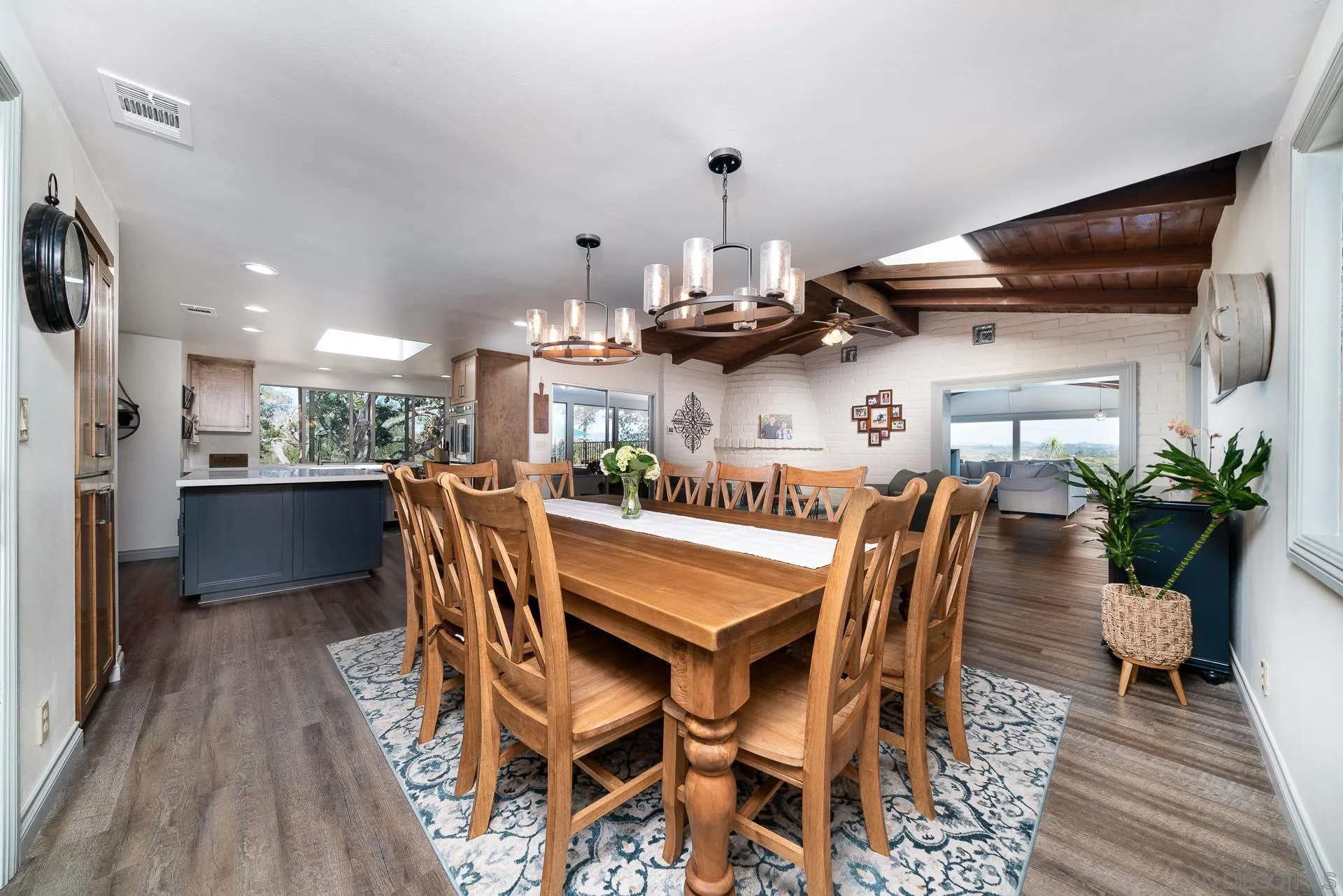 3978 Ladera Vista Road Fallbrook, CA 92028 - Photo 7 of 48 a dining room with furniture and wooden floor