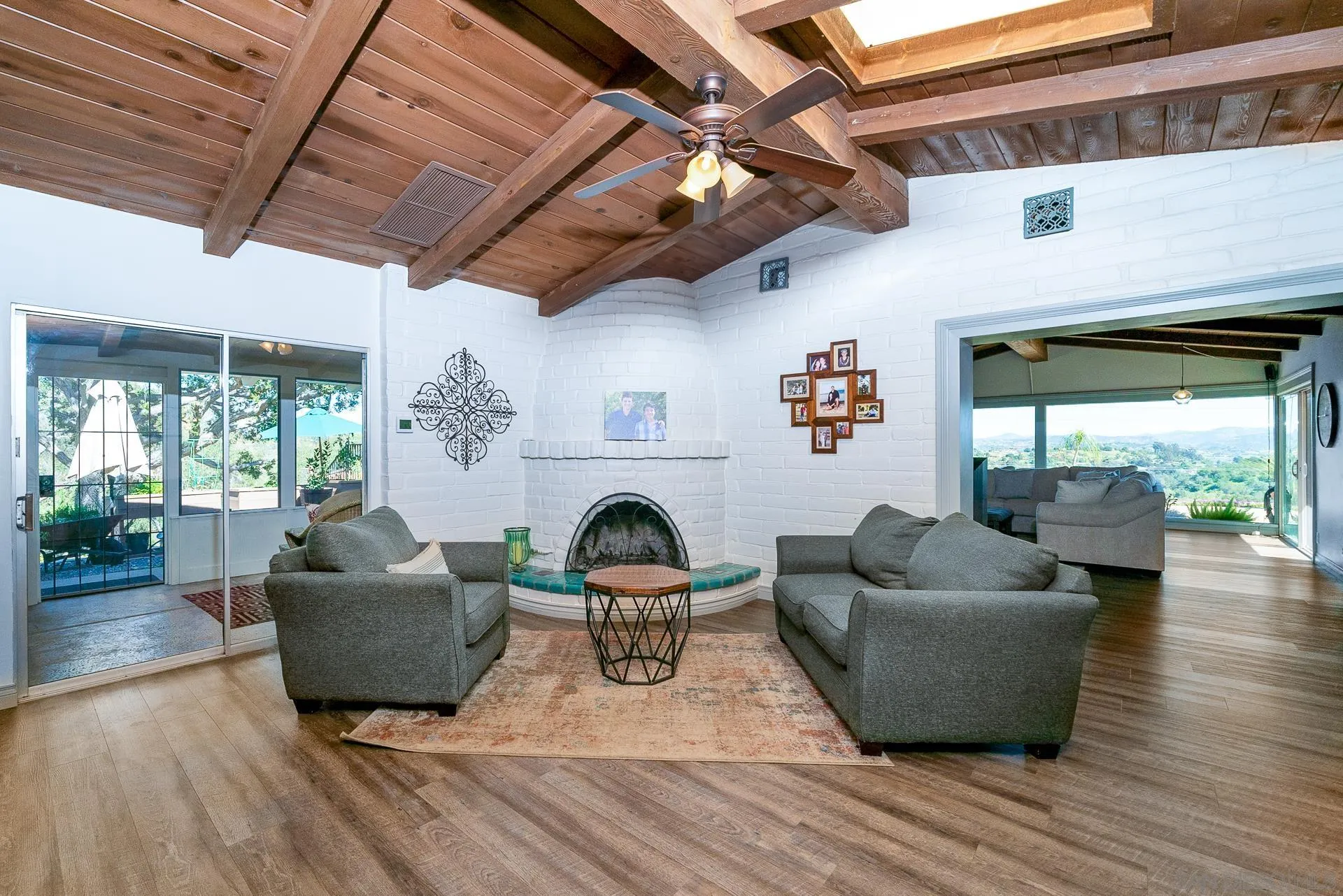 3978 Ladera Vista Road Fallbrook, CA 92028 - Photo 8 of 48 a living room with furniture and a fireplace